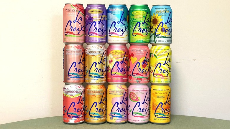 15 La Croix flavors stacked on a table