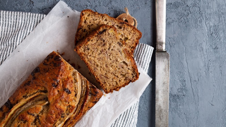 banana bread on counter with a knife