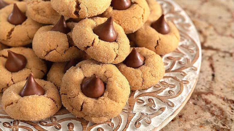Peanut butter blossom cookies on an ornate plate