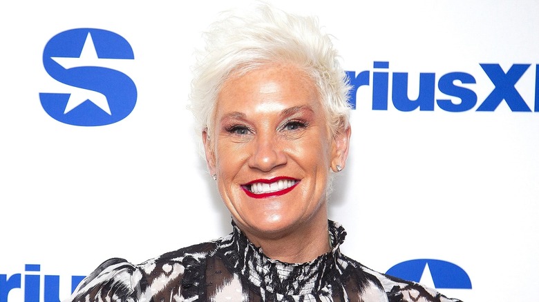 Anne Burrell smiling with teeth, wearing rep lipstick